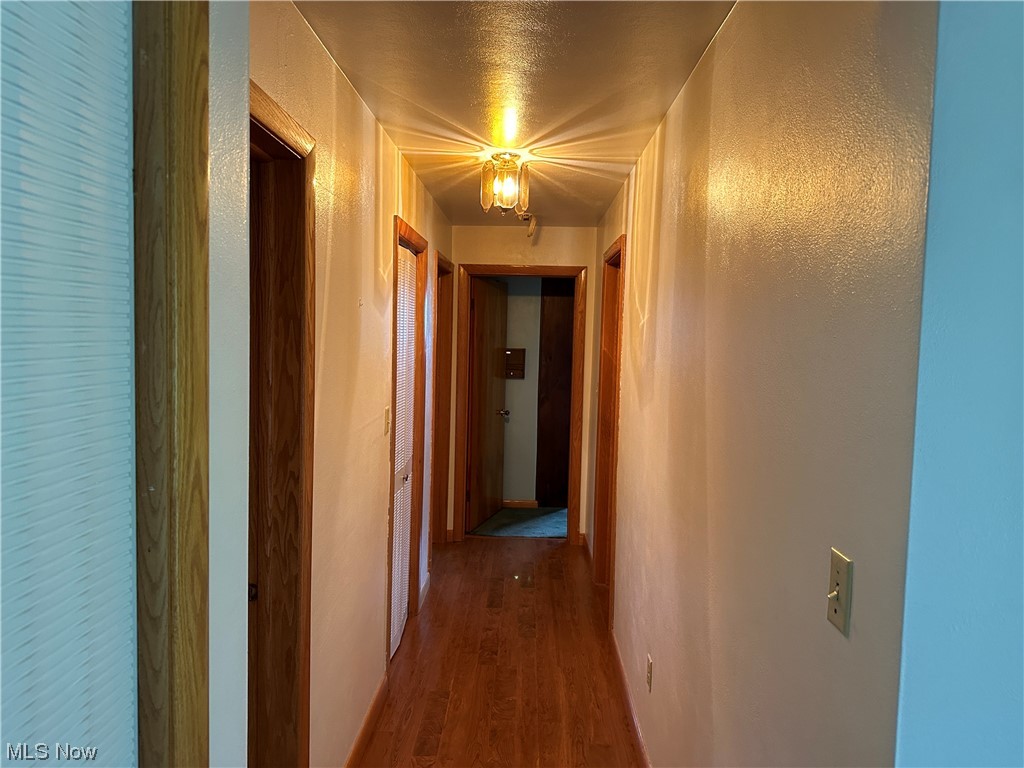 62273 Tacoma Road Barnesville, OH 43713 - Photo 20 of 34 Corridor featuring dark hardwood flooring