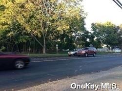 52 Main Road Riverhead, NY 11901 - Photo 11 of 13 a car parked on the side of the road