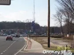 a view of street with parked cars