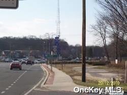 52 Main Road Riverhead, NY 11901 - Photo 8 of 13 a view of a parking area