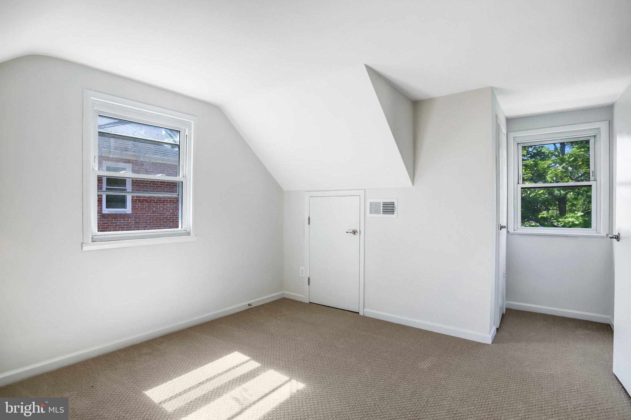 616 Ritchie Avenue Silver Spring, MD 20910 - Photo 20 of 37 a view of an empty room with a window