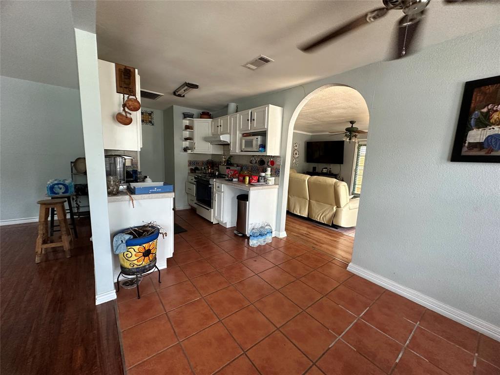2707 Jim Street Dallas, TX 75212 - Photo 11 of 17 a living room with furniture and a fireplace