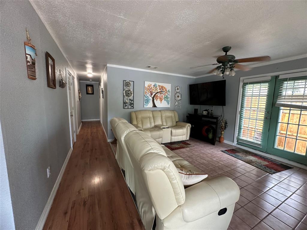2707 Jim Street Dallas, TX 75212 - Photo 7 of 17 a living room with furniture and a flat screen tv
