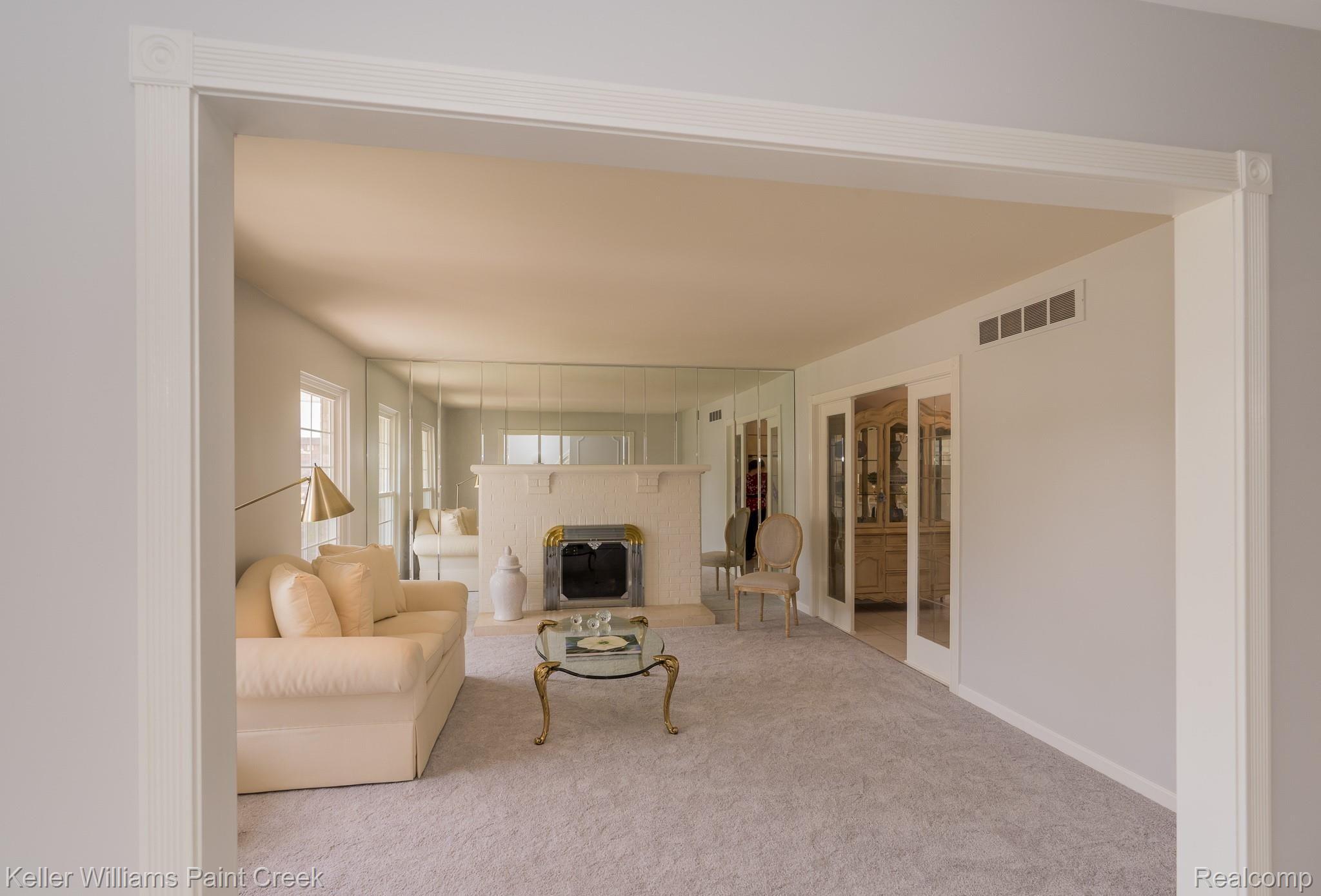 518 Kentucky Drive Rochester, MI 48307 - Photo 10 of 42 Living room with natural fireplace and new carpet