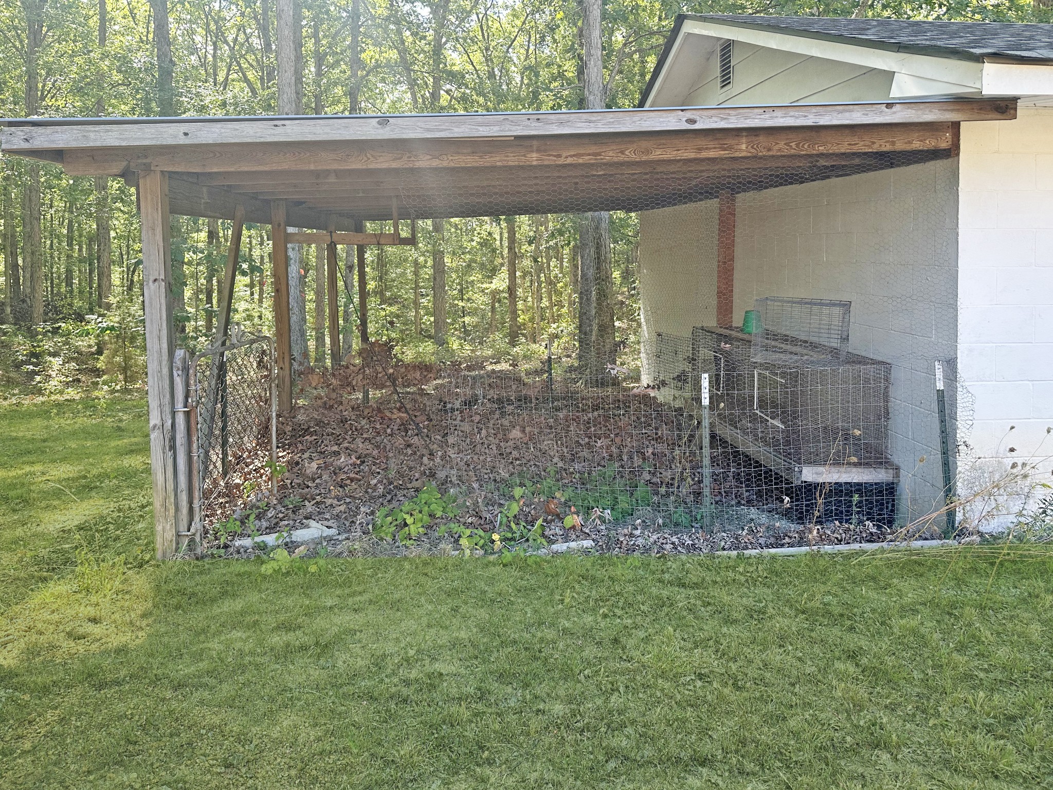 4939 Highway 49 Tennessee Ridge, TN 37178 - Photo 11 of 40 The covered area attached to the garage was previously used for chickens and rabbits.