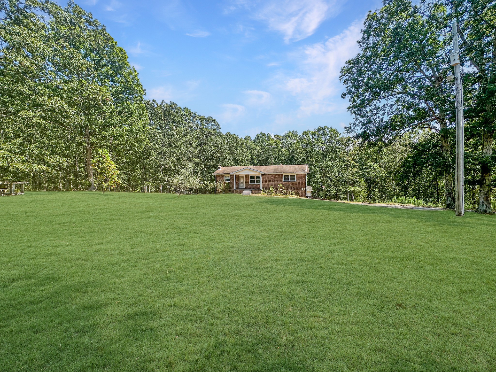 4939 Highway 49 Tennessee Ridge, TN 37178 - Photo 2 of 40 This home sits back off the road in a beautiful stand of mature oak trees.