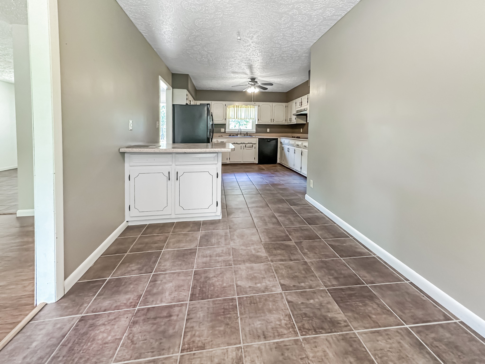 4939 Highway 49 Tennessee Ridge, TN 37178 - Photo 26 of 40 Another view of the kitchen, standing in the breakfast nook. The formal dining room is to the left.
