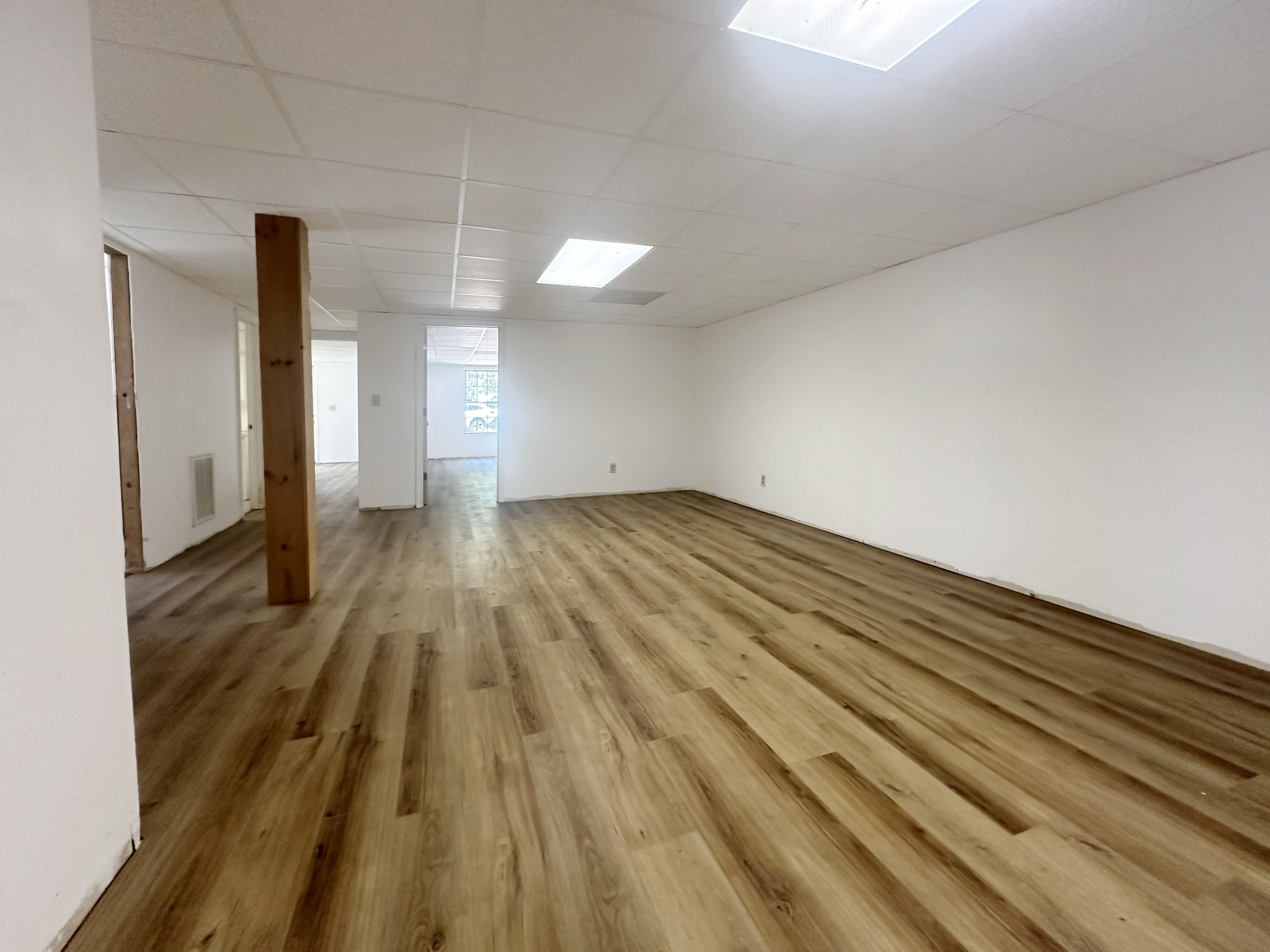 4939 Highway 49 Tennessee Ridge, TN 37178 - Photo 33 of 40 The rec room in the basement just had all new flooring.