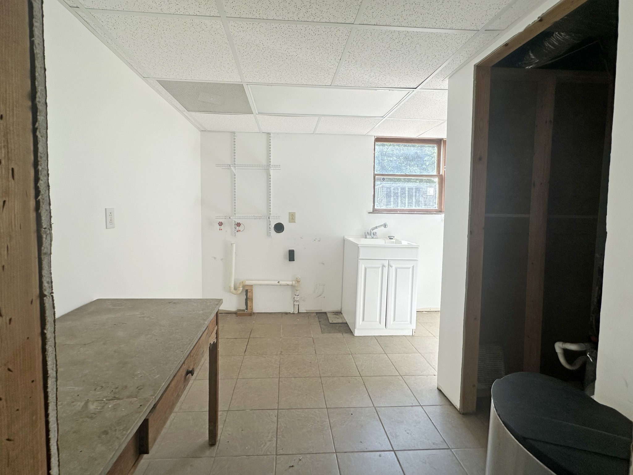 4939 Highway 49 Tennessee Ridge, TN 37178 - Photo 40 of 40 The large laundry room is in the basement. Lots of folding space and a large washout sink.