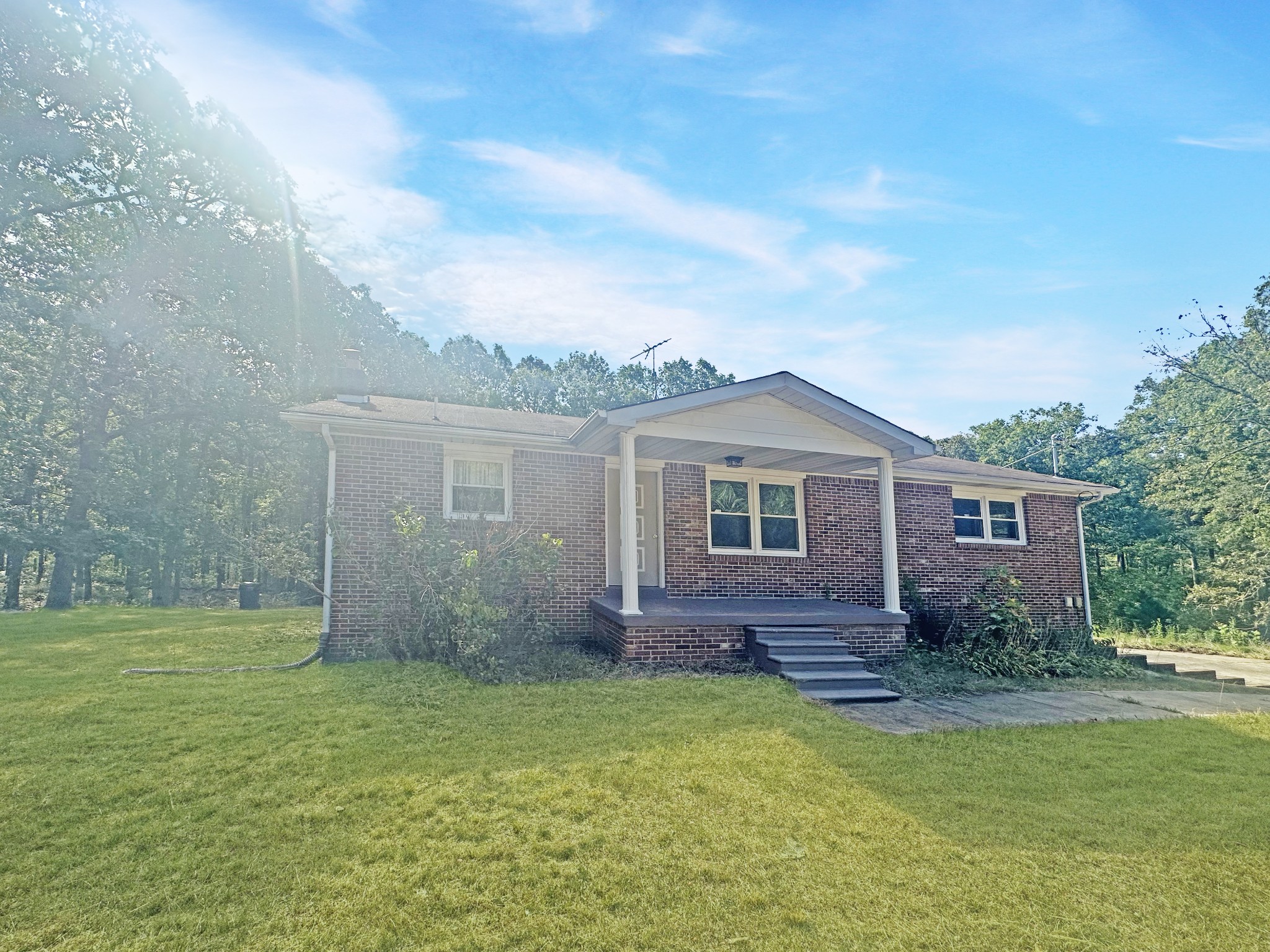 4939 Highway 49 Tennessee Ridge, TN 37178 - Photo 4 of 40 There's a cute covered porch on the front.