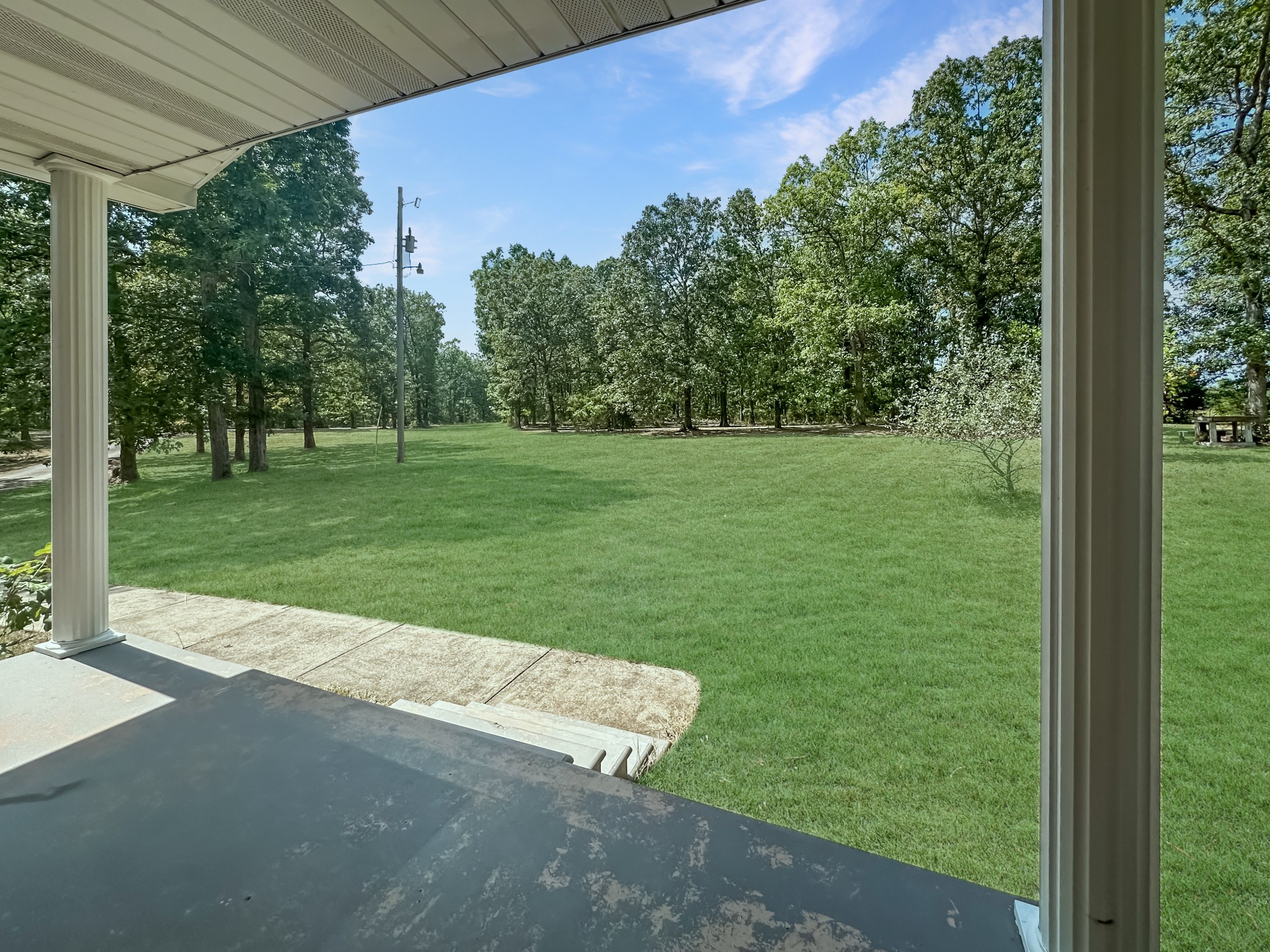 4939 Highway 49 Tennessee Ridge, TN 37178 - Photo 5 of 40 Looking from the front porch towards the front yard. The driveway is to the left.