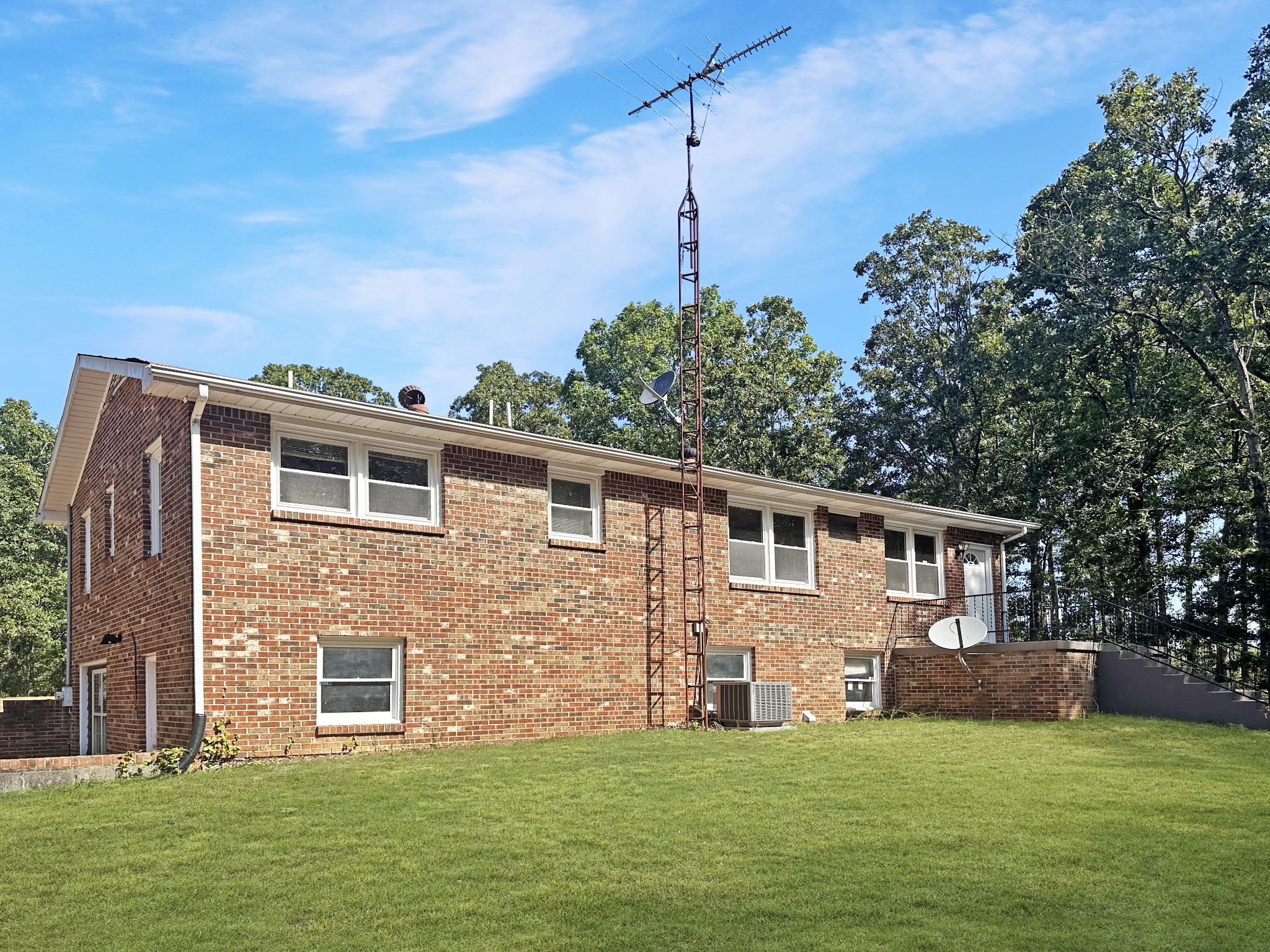 4939 Highway 49 Tennessee Ridge, TN 37178 - Photo 8 of 40 The back of the home, showing the concrete patio.