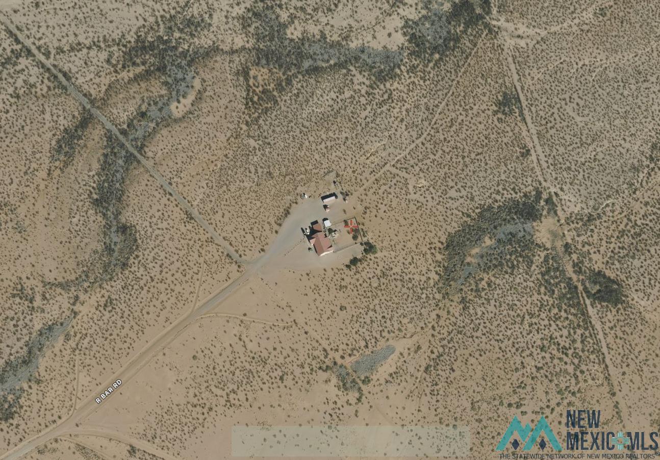 33 R Bar Road Rodeo, NM 88056 - Photo 2 of 20 Aerial(satellite) view of the home on 280 acres.