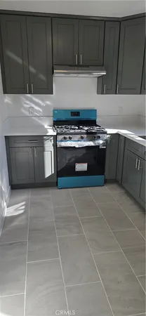 a kitchen with a cabinets and a stove