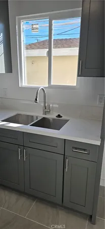 a kitchen with a sink and a window