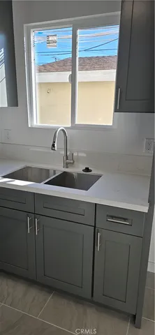 a kitchen with a sink and a window