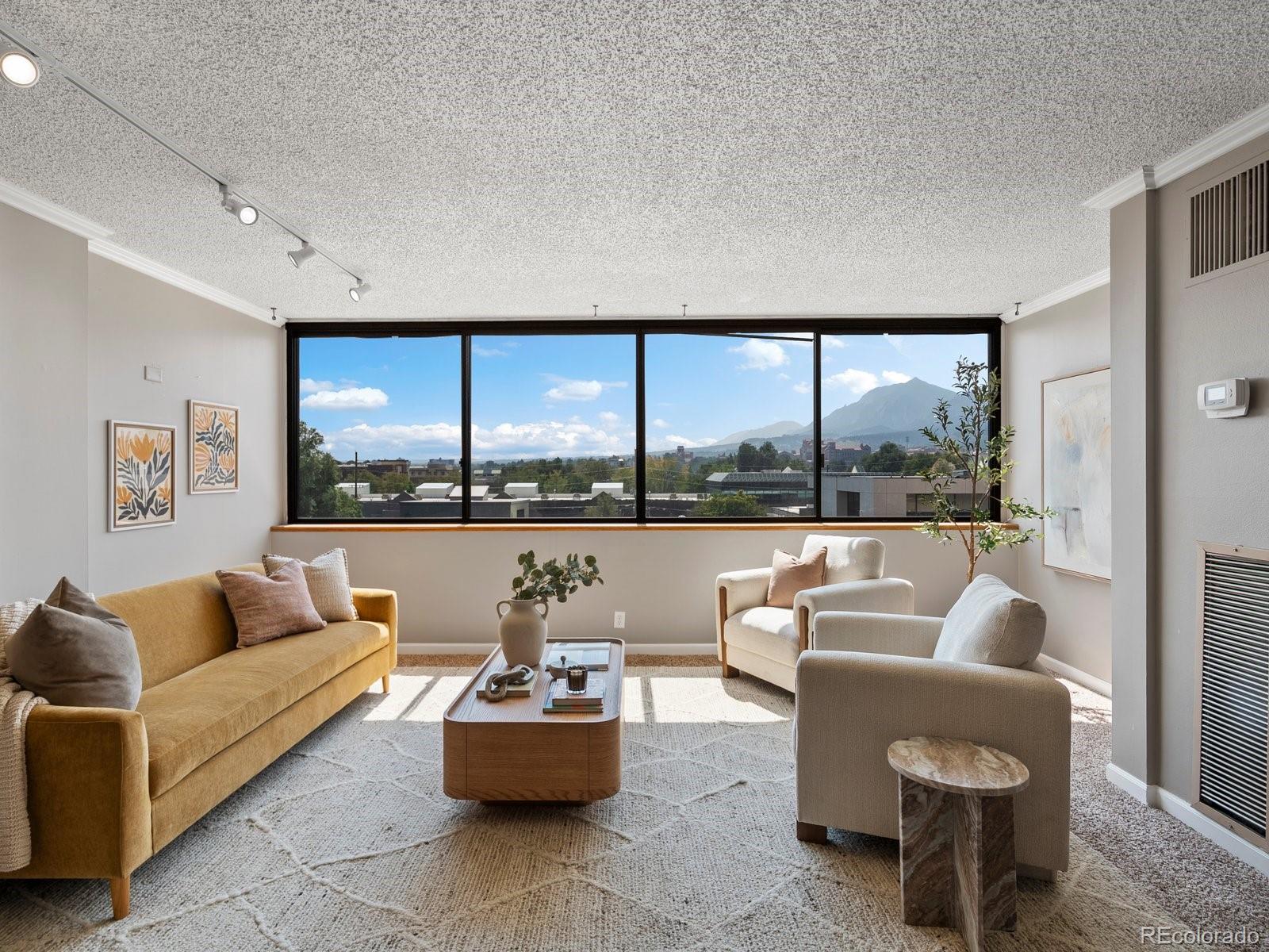 1850 Folsom Street, Unit 402 Boulder, CO 80302 - Photo 1 of 28 a living room with furniture and a large window