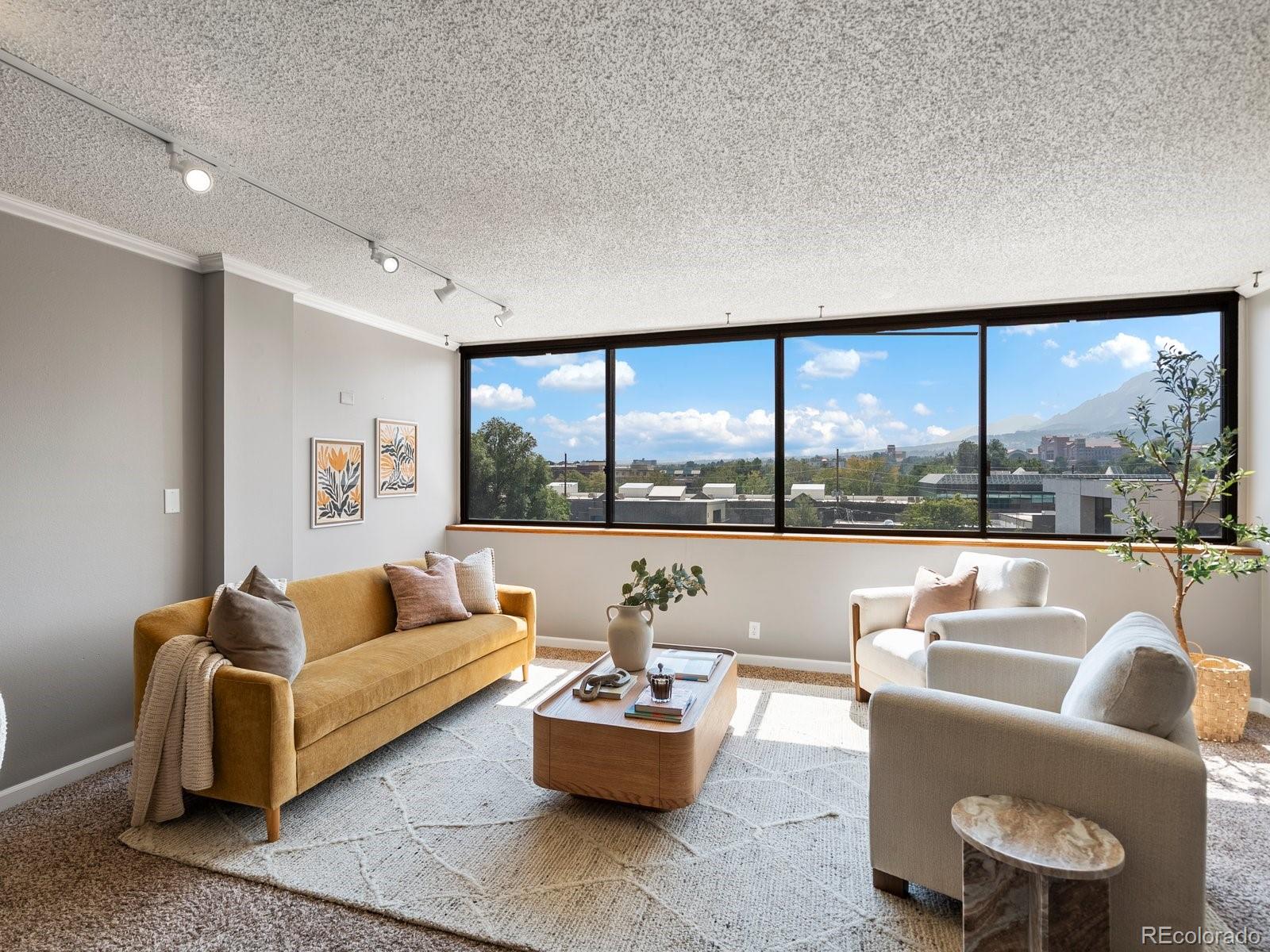 1850 Folsom Street, Unit 402 Boulder, CO 80302 - Photo 14 of 28 a living room with furniture and a large window