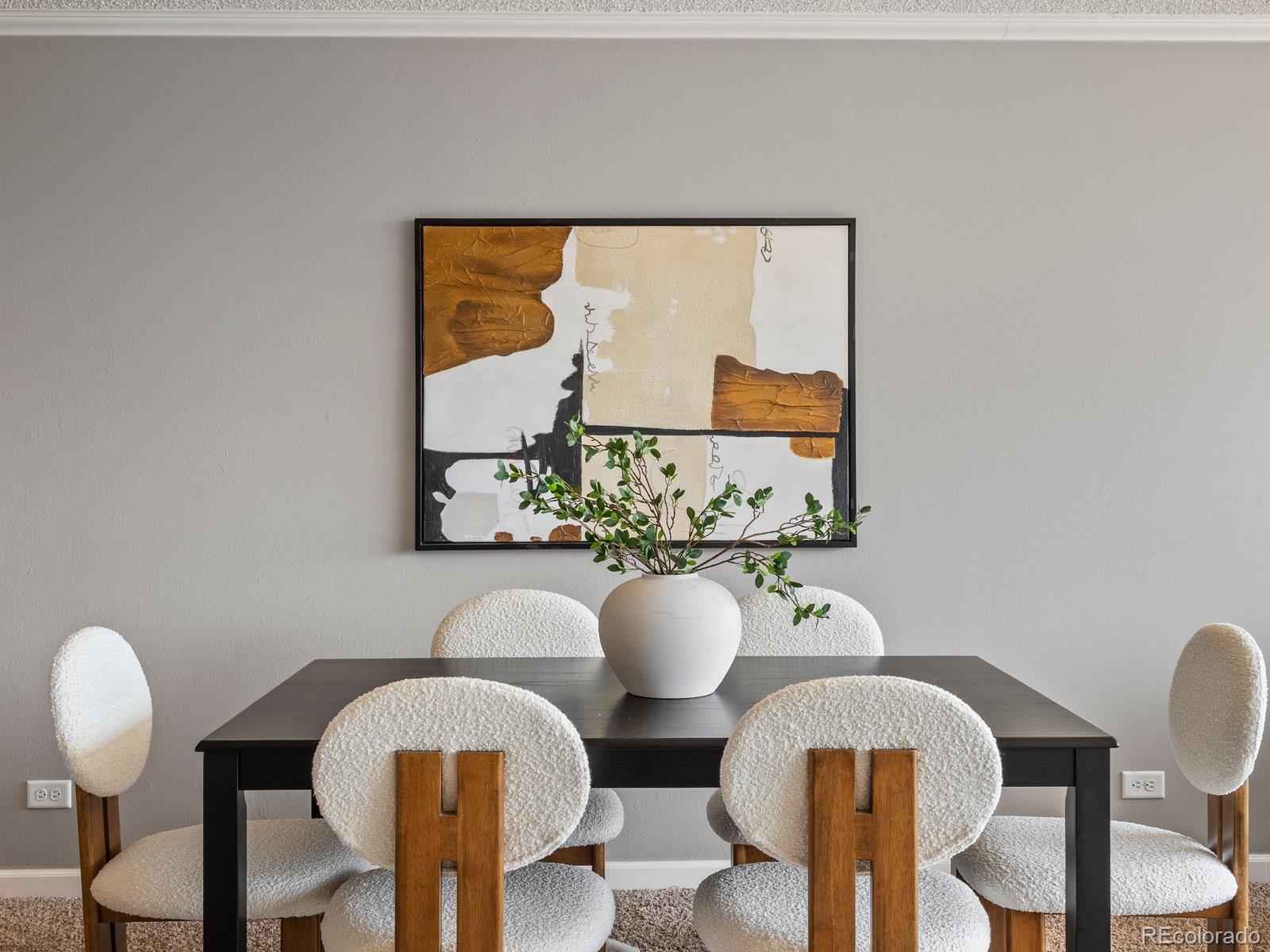 1850 Folsom Street, Unit 402 Boulder, CO 80302 - Photo 16 of 28 a view of a dining room with furniture and wooden floor
