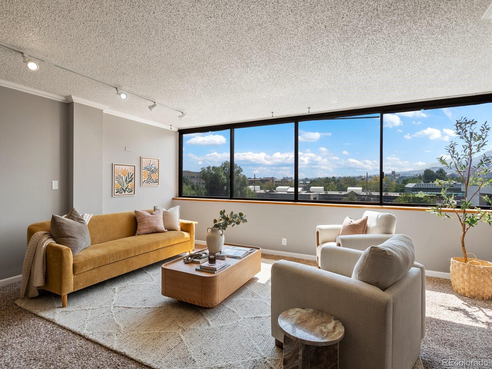 1850 Folsom Street, Unit 402 Boulder, CO 80302 - Photo 17 of 28 a living room with furniture and a large window