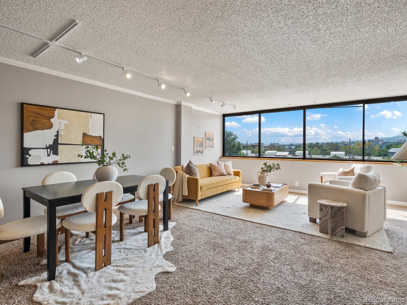 1850 Folsom Street, Unit 402 Boulder, CO 80302 - Photo 2 of 28 a living room with furniture and a large window