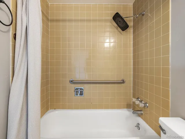 a bedroom with bed and window