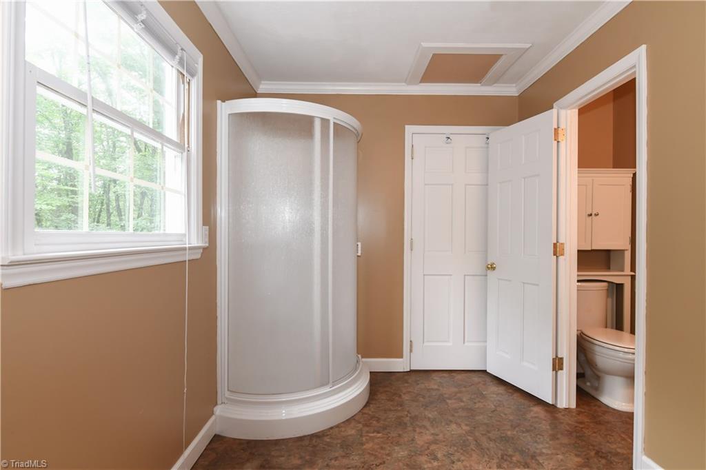 1010 Ivy Road Danbury, NC 27016 - Photo 15 of 27 Shower and powder room are private for the upper level bedroom.