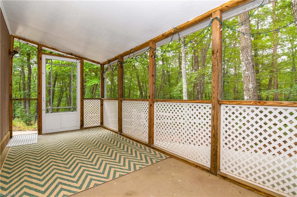 1010 Ivy Road Danbury, NC 27016 - Photo 20 of 27 Private screened porch is located off the master and looks directly into the woods surrounding the property.