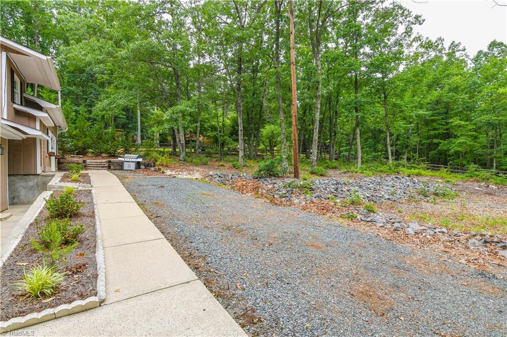 1010 Ivy Road Danbury, NC 27016 - Photo 21 of 27 Driveway offers plenty of room to park, and yard can be used for gardens or play areas.