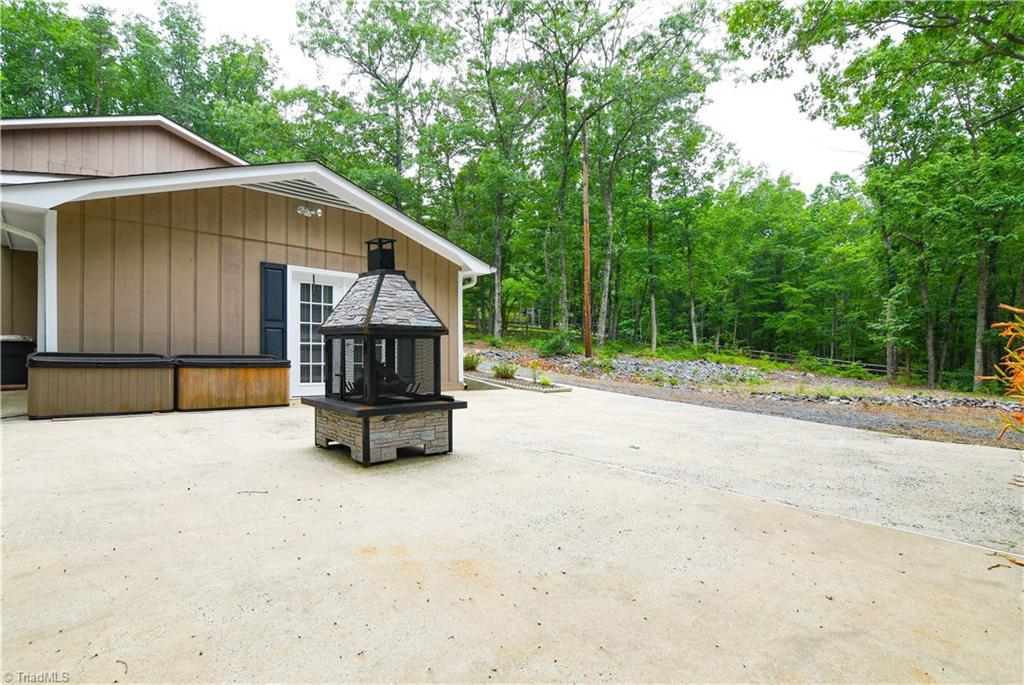 1010 Ivy Road Danbury, NC 27016 - Photo 23 of 27 Fire pit area and concrete patio/pad off of the master area.