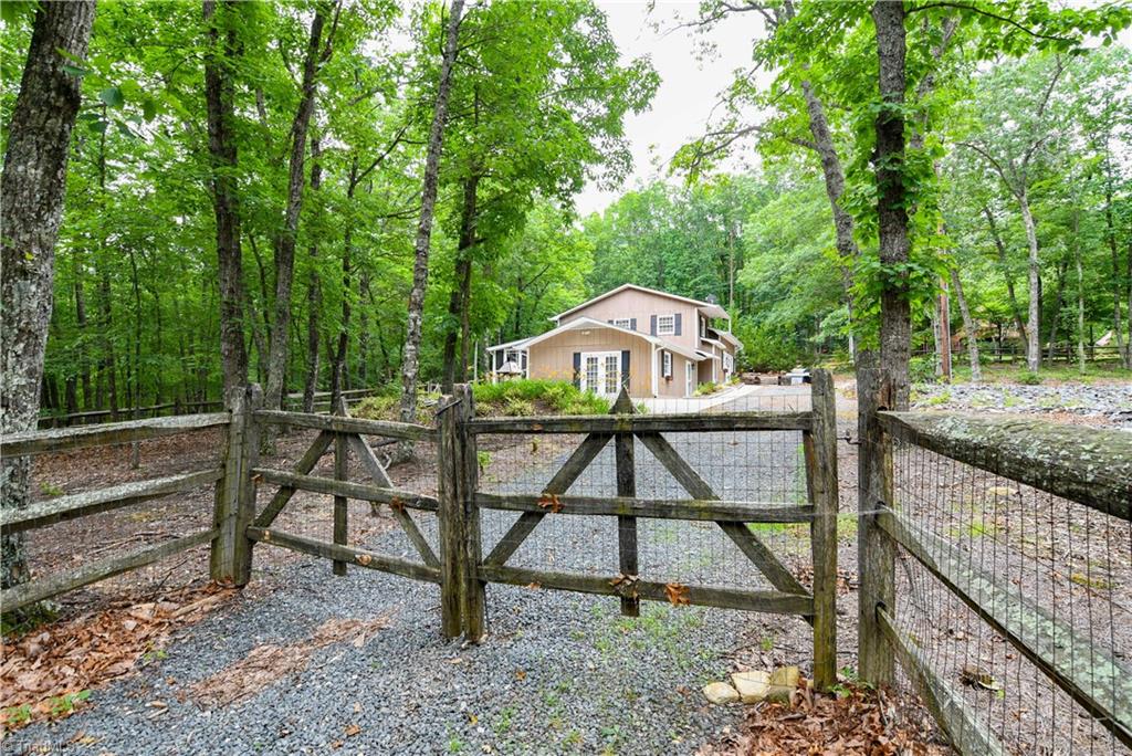 1010 Ivy Road Danbury, NC 27016 - Photo 27 of 27 Privacy, nature, and a wonderful home await you as you go through this gate! You won't want to leave!