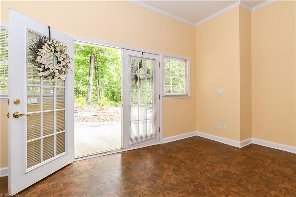 1010 Ivy Road Danbury, NC 27016 - Photo 5 of 27 Entrance into the large living area which features den, kitchen, and dining.