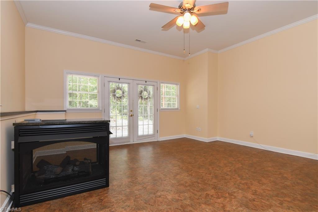1010 Ivy Road Danbury, NC 27016 - Photo 6 of 27 A dual sided gas fireplace adds warm, cozy addition to fall and winter nights.