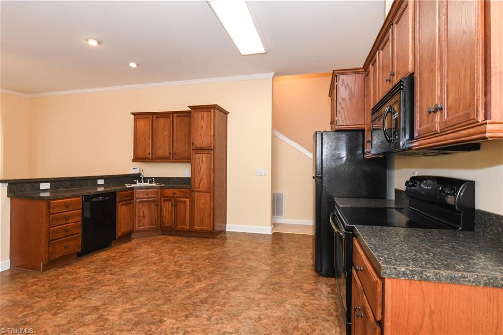 1010 Ivy Road Danbury, NC 27016 - Photo 8 of 27 Update kitchen featuring newer cabinets, and appliances. Also offers ample counter space.
