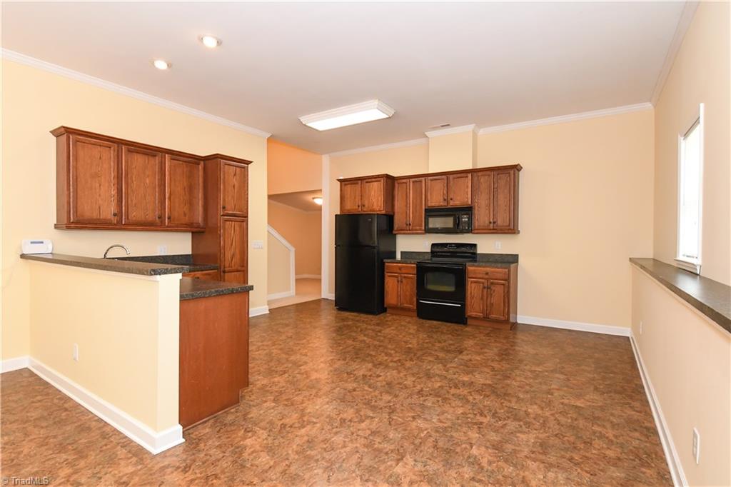 1010 Ivy Road Danbury, NC 27016 - Photo 9 of 27 A side shot of the kitchen and dining area.