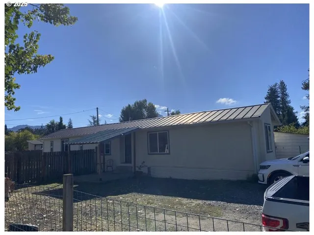 a house with trees in the background