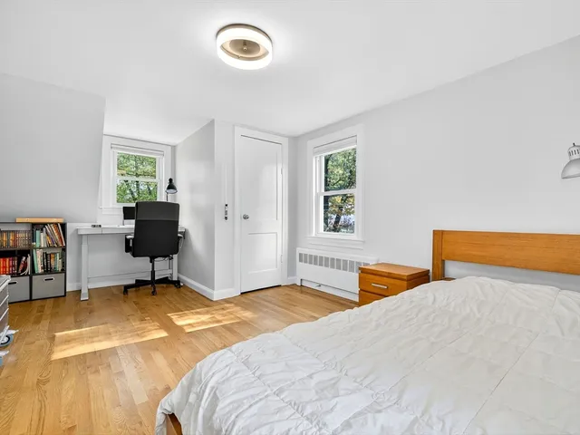 a bedroom with a bed and furniture