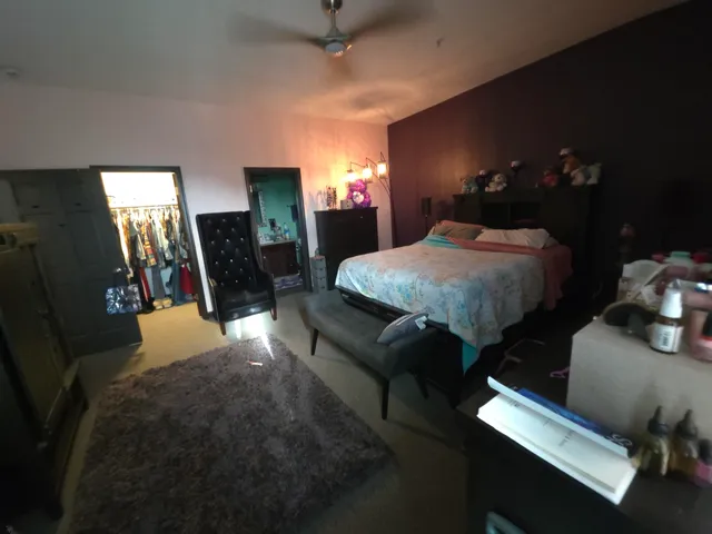 a bedroom with bed and window