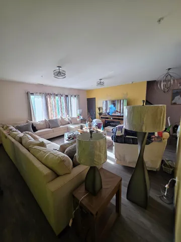 a living room with furniture and a window