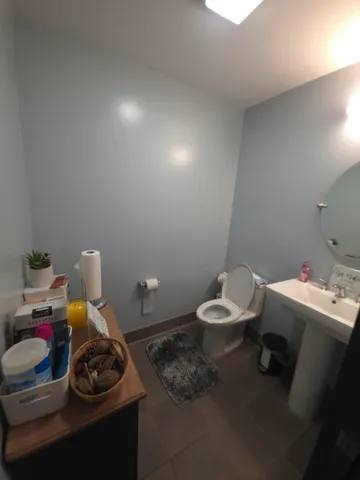 a bathroom with a sink and toilet