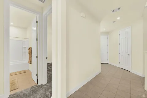 a view of a hallway with an empty room