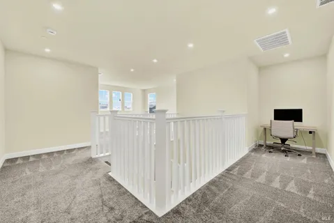a view of a livingroom with a staircase