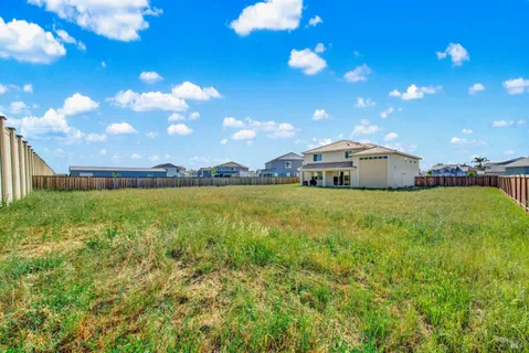 a view of a house with a big yard