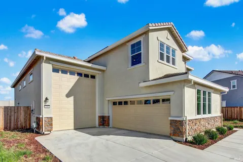a front view of a house with a garage