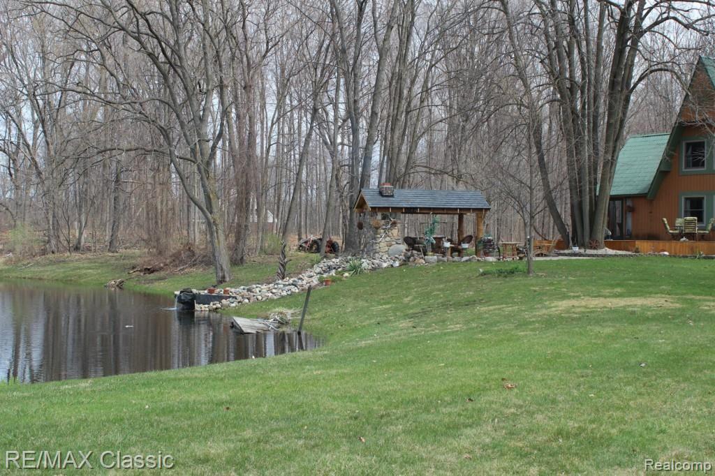 26760 Johns Road Wixom, MI 48393 - Photo 5 of 32 POND AND WATERFALL