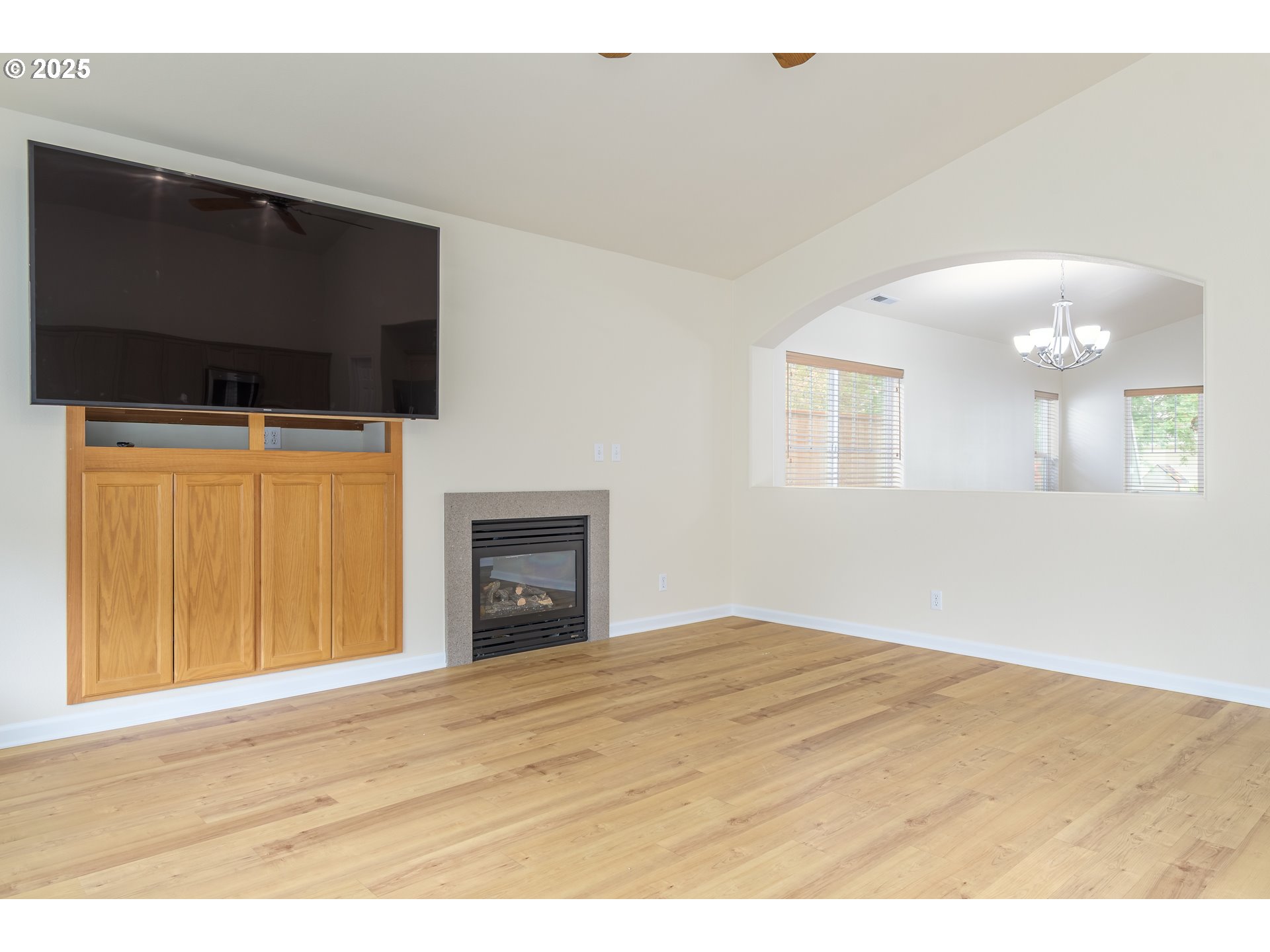 5470 Jeffrey Way Eugene, OR 97402 - Photo 13 of 48 a view of an empty room with wooden floor and a window