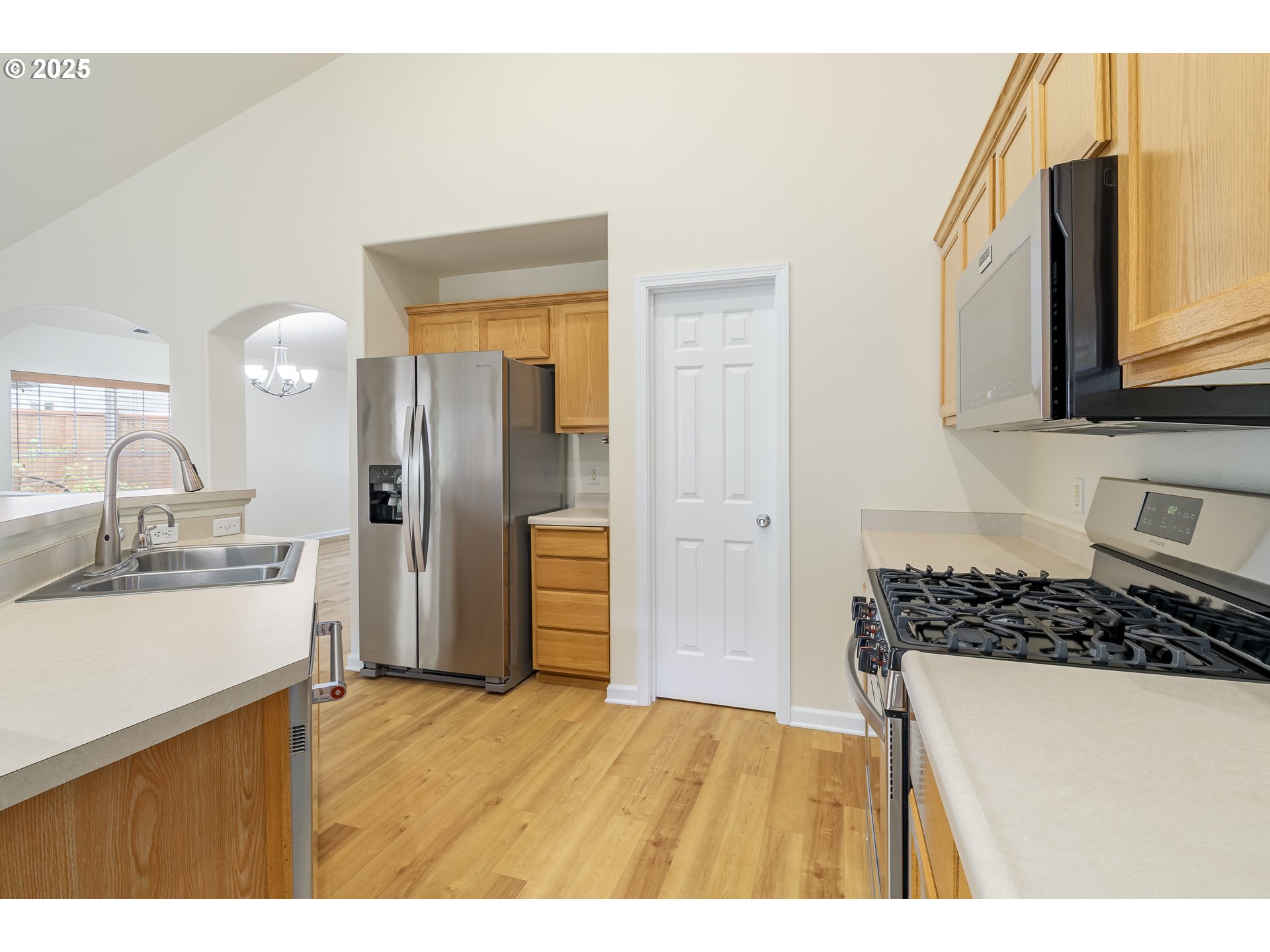5470 Jeffrey Way Eugene, OR 97402 - Photo 15 of 48 a kitchen with a refrigerator and a sink