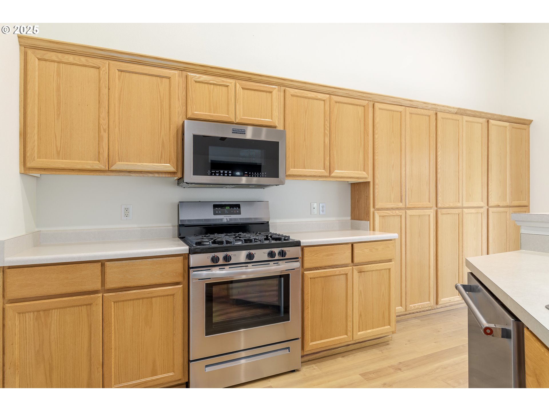 5470 Jeffrey Way Eugene, OR 97402 - Photo 17 of 48 a kitchen with granite countertop white cabinets stainless steel appliances and a sink