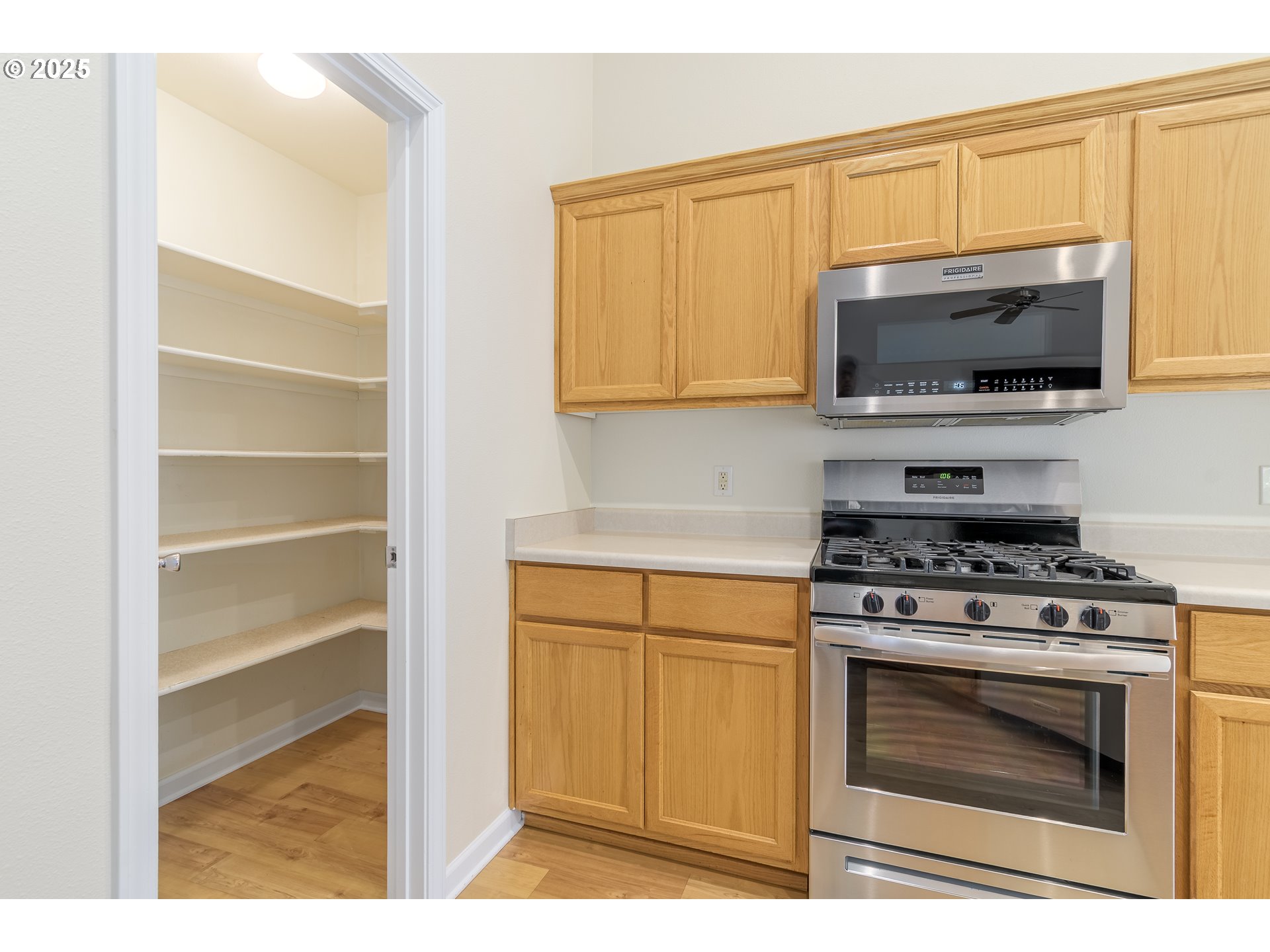 5470 Jeffrey Way Eugene, OR 97402 - Photo 18 of 48 a kitchen with a stove and a microwave