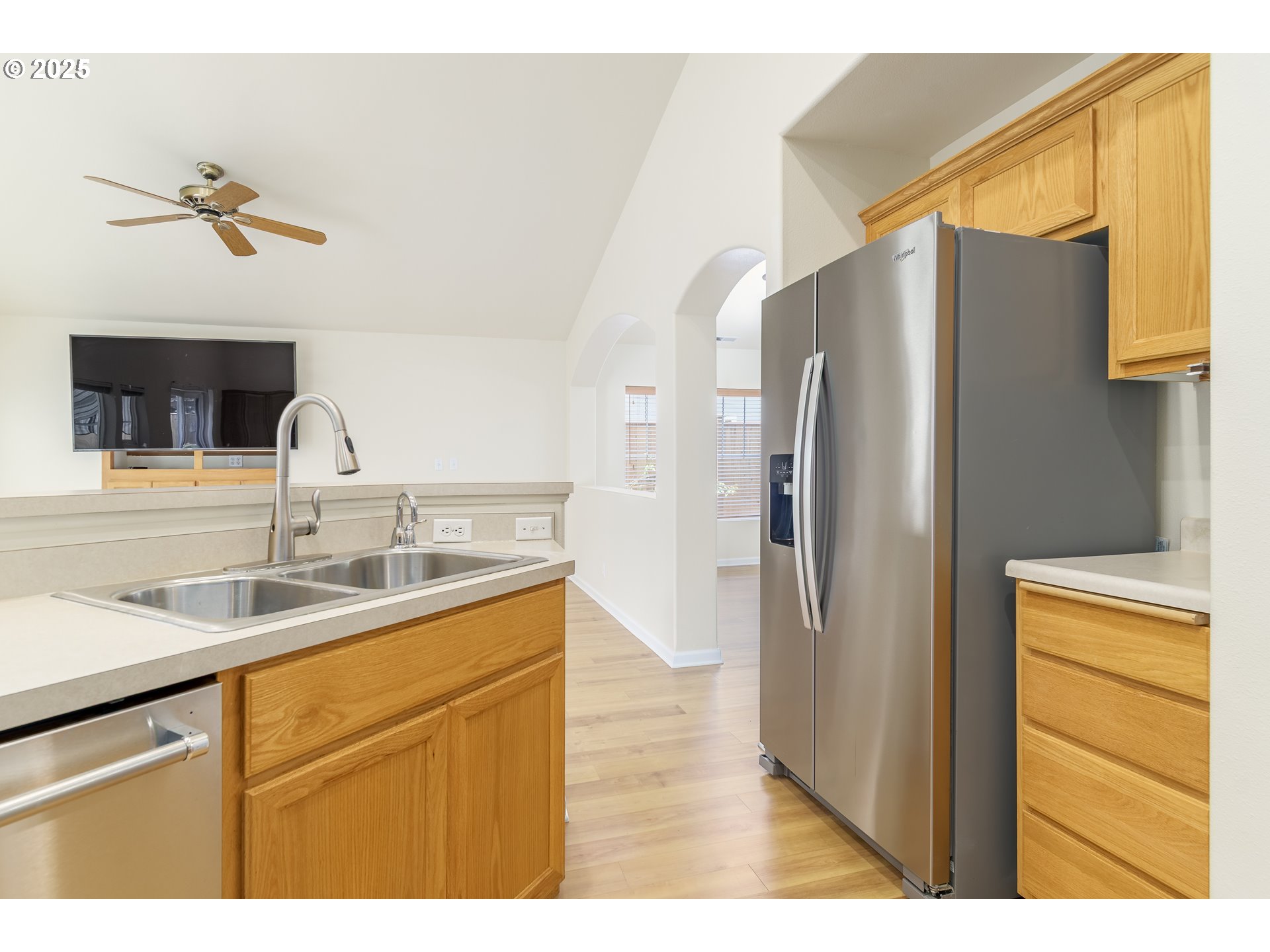 5470 Jeffrey Way Eugene, OR 97402 - Photo 19 of 48 a kitchen with stainless steel appliances granite countertop a refrigerator and a sink